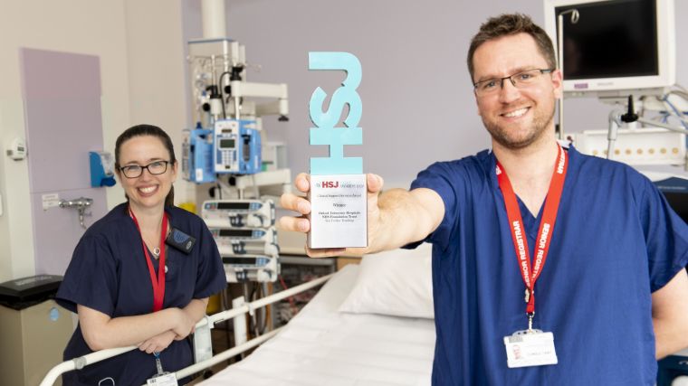 Dr Claire Pickering and Dr Chris Gough hold their HSJ award.